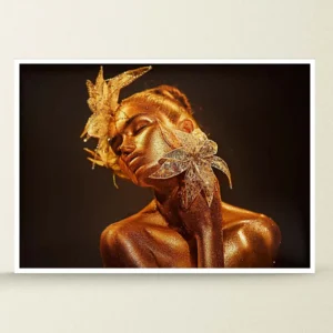 Abstract portrait of a woman with gold face paint and dark background.