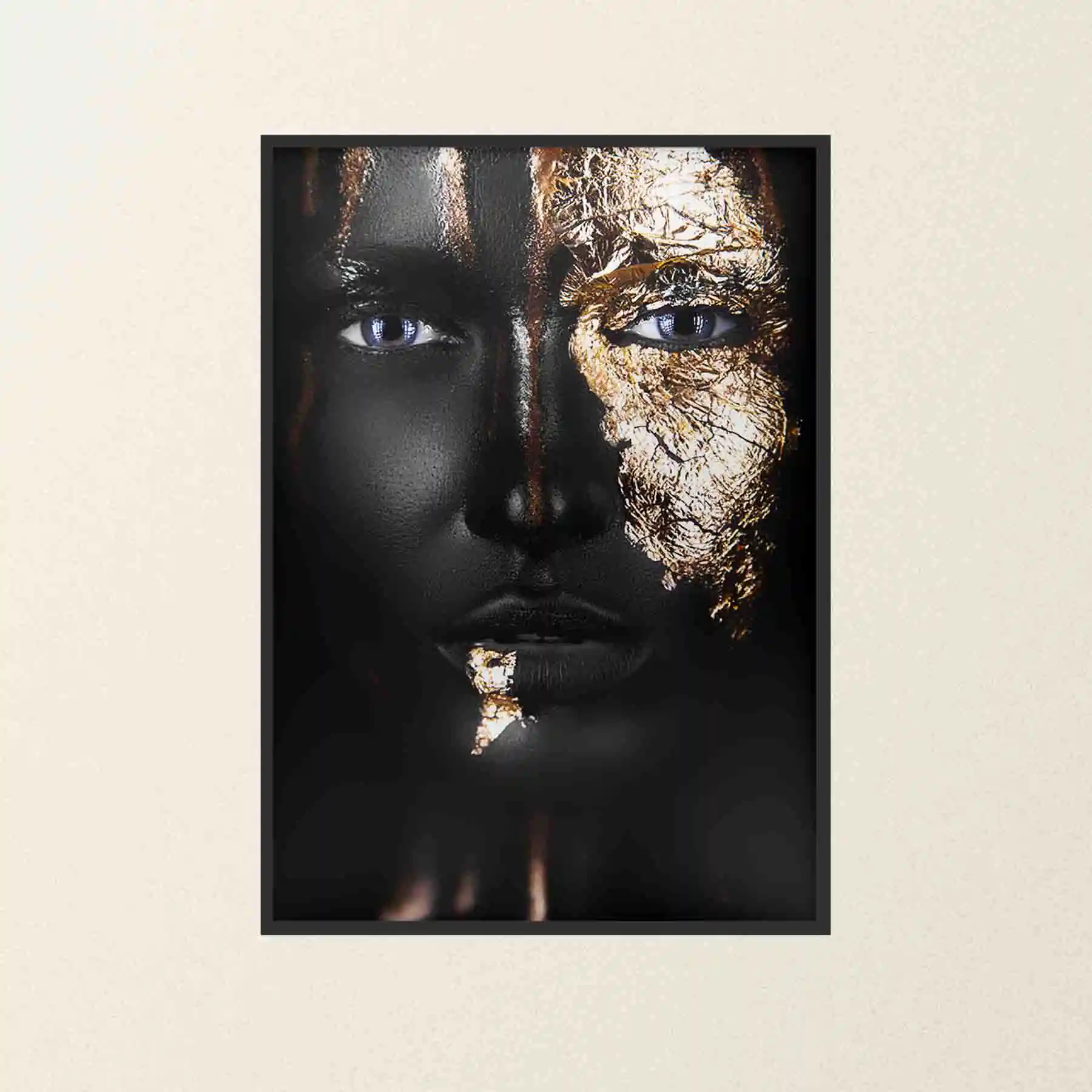 Abstract portrait of a woman with gold lips and nails.