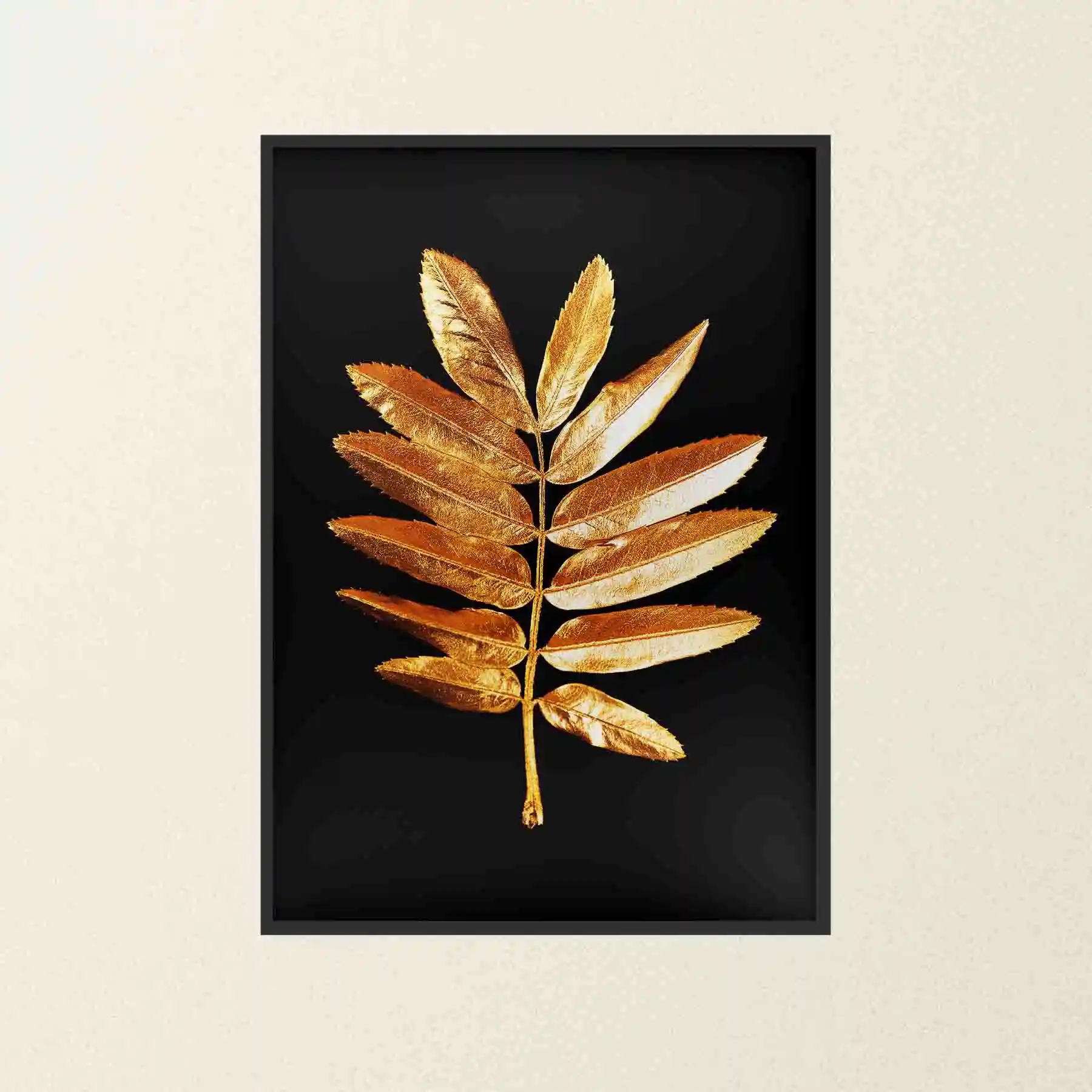 Abstract image of a gold fern leaf on a black background.