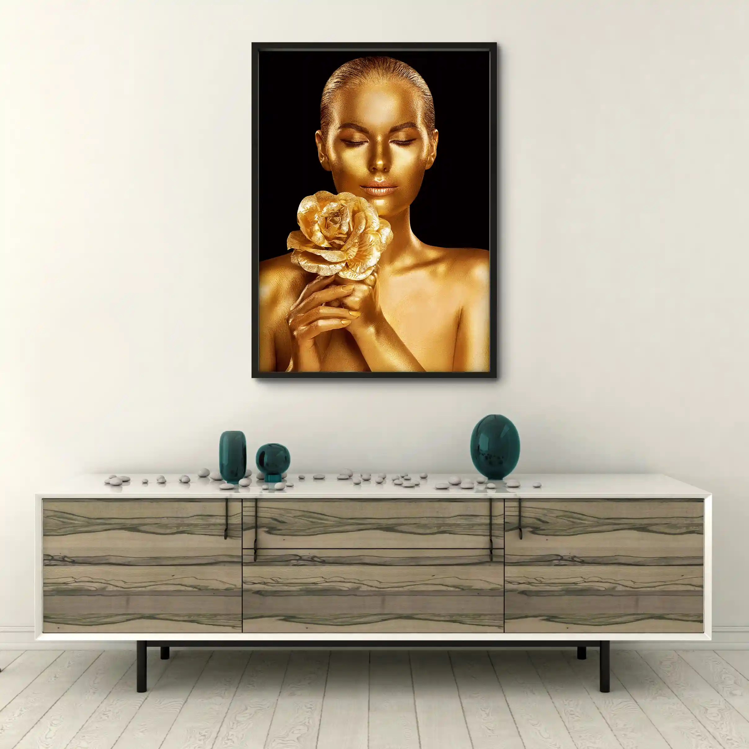 Abstract portrait of a woman with gold body paint and golden rose.