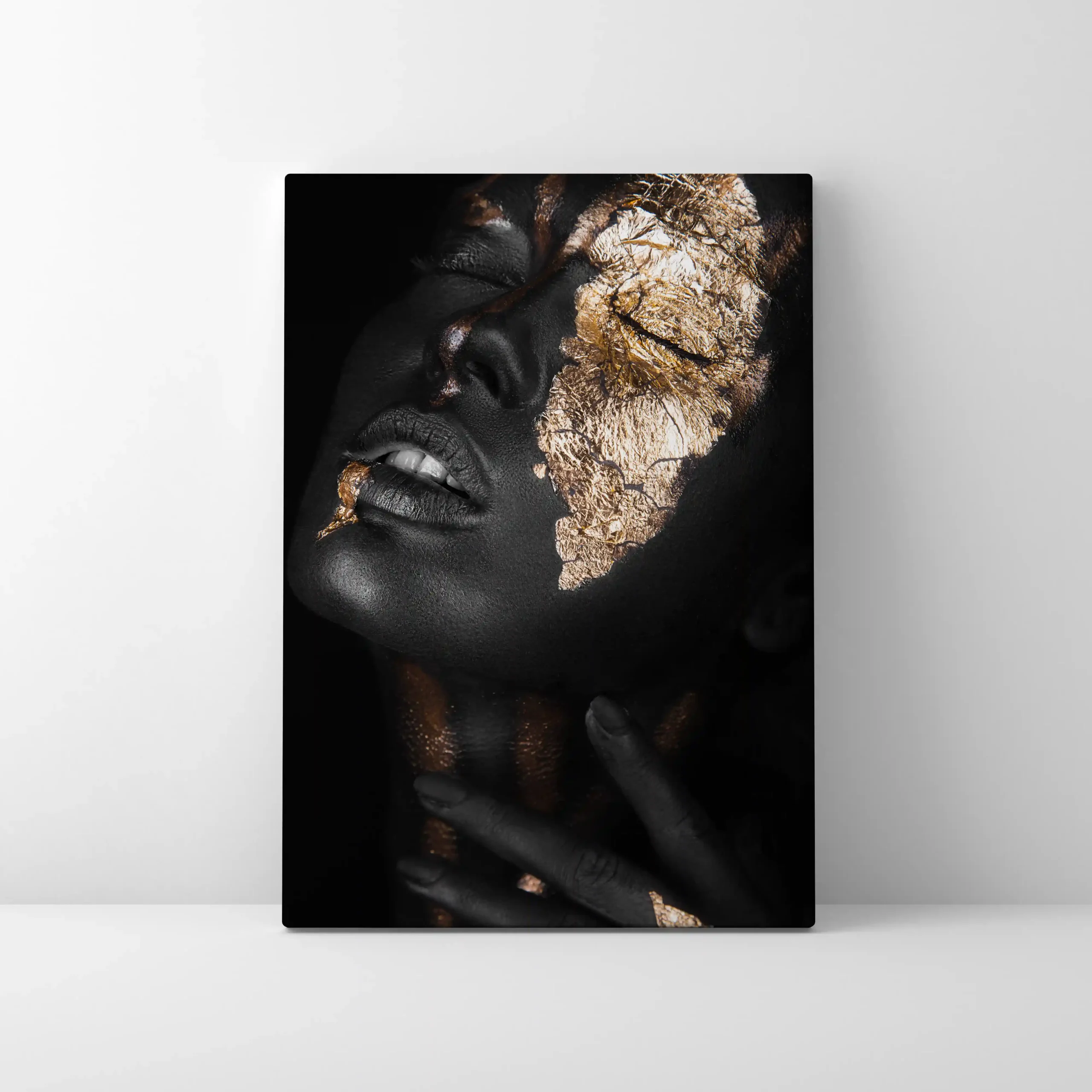 Abstract portrait of a woman with gold leaf accents.