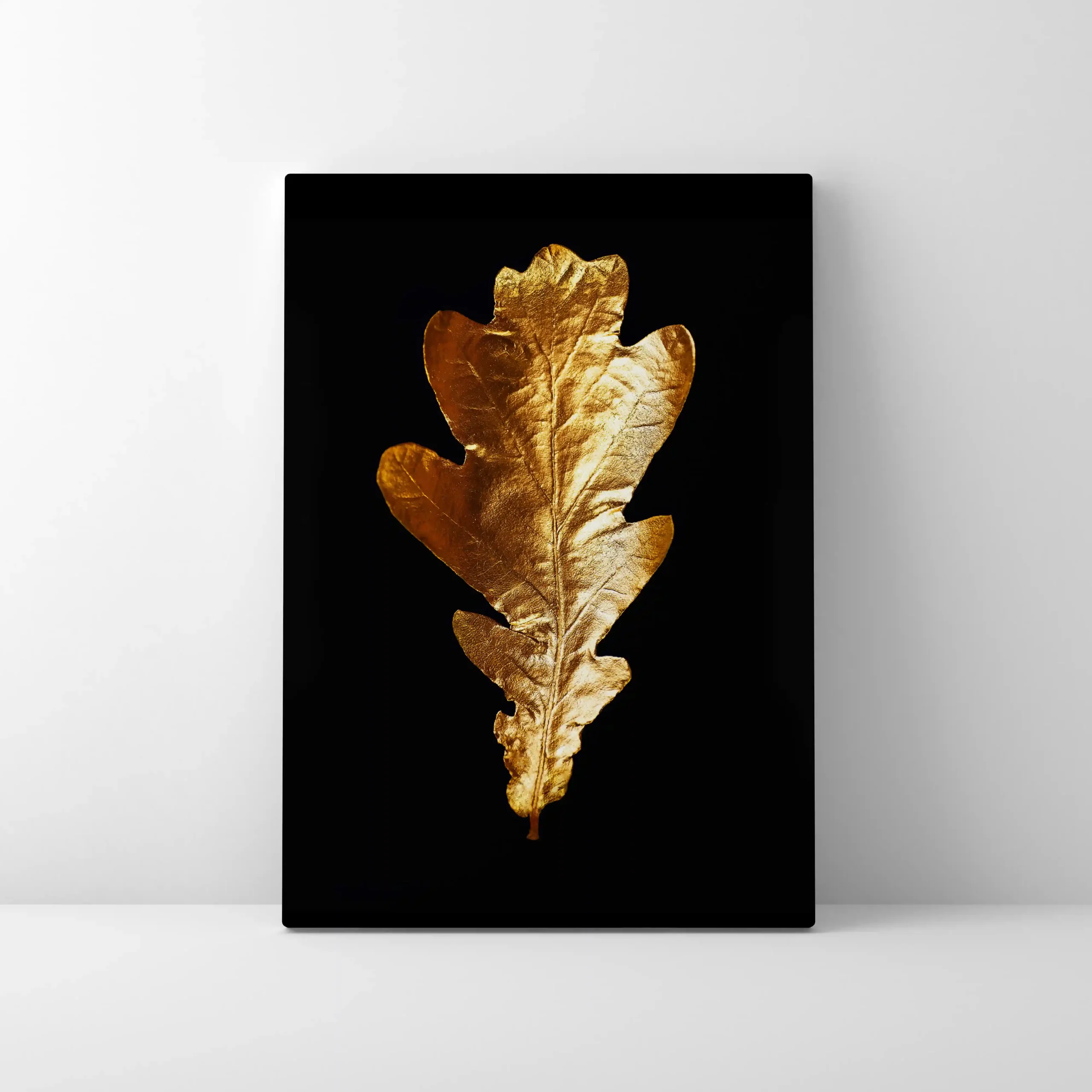 Abstract image of gold leaves on a black background.