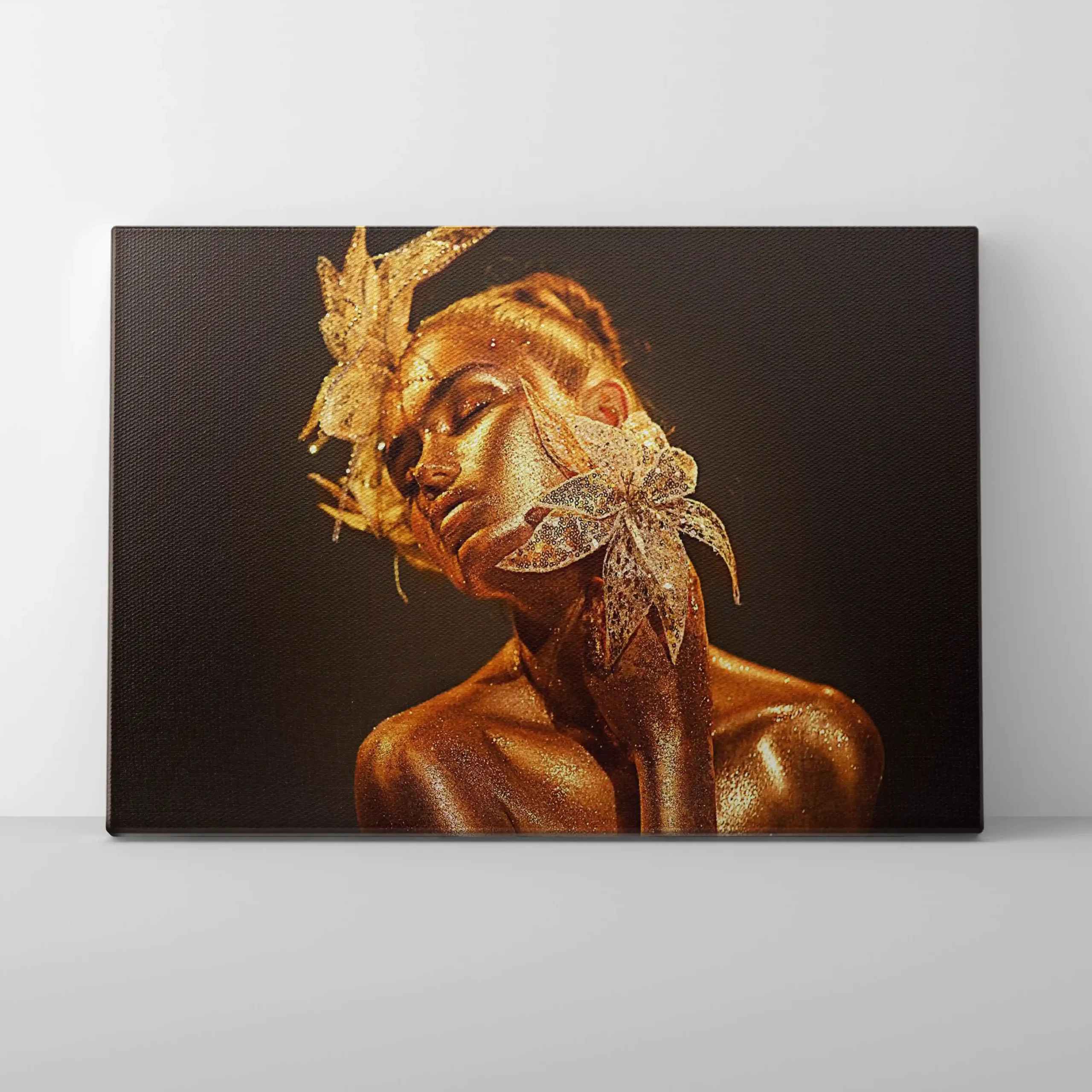 Abstract portrait of a woman with gold face paint and dark background.