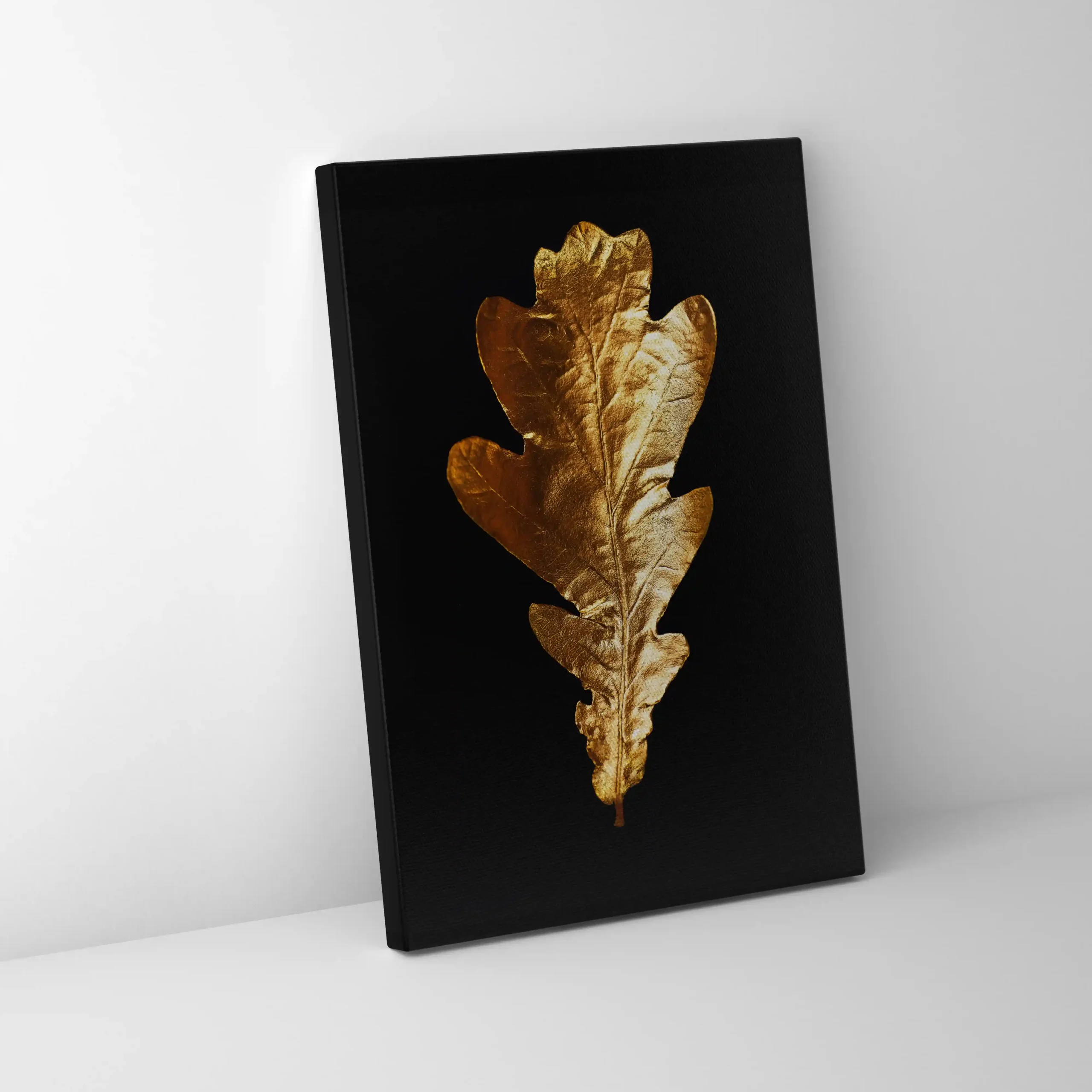 Abstract image of gold leaves on a black background.