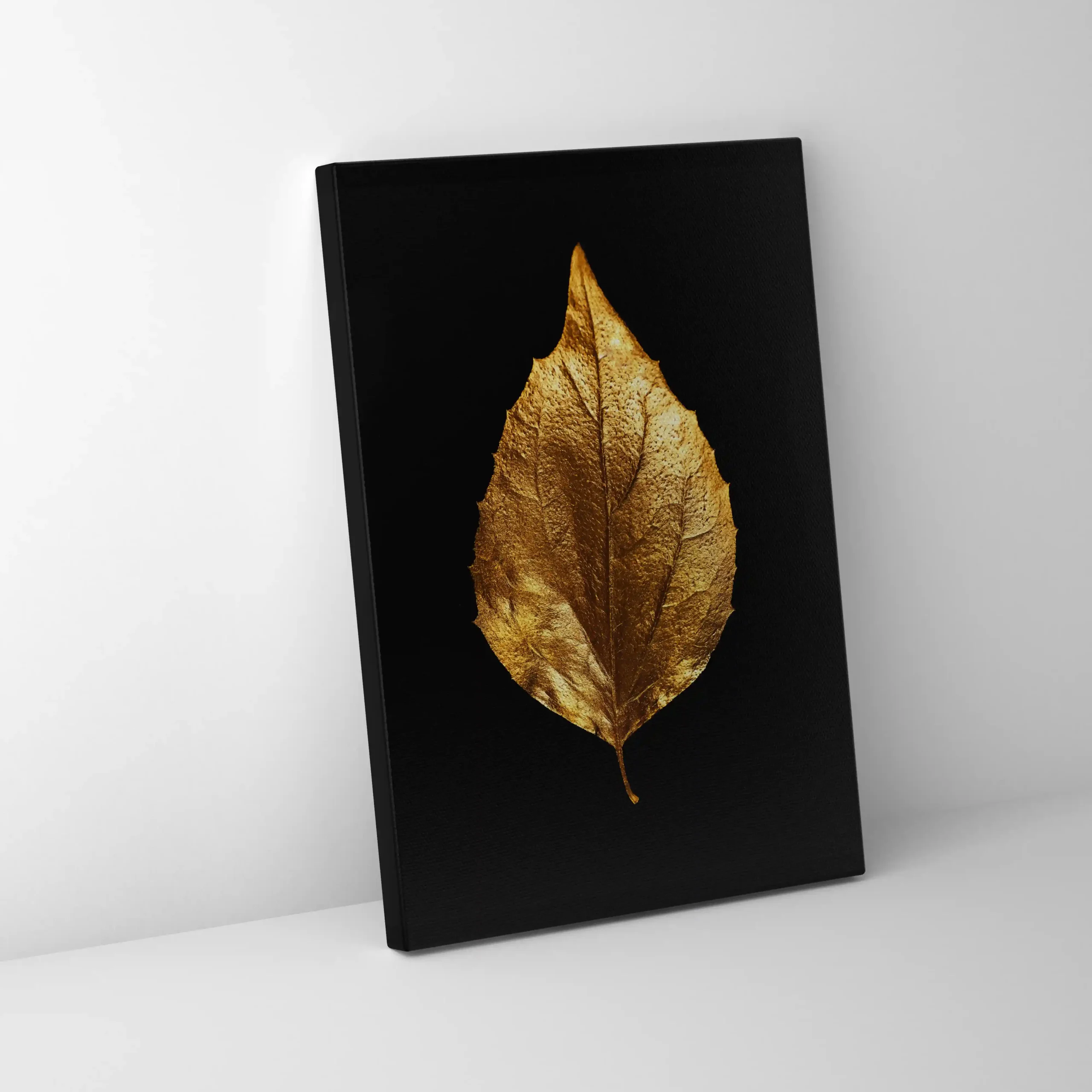 Abstract image of a gold leaf on a black background.