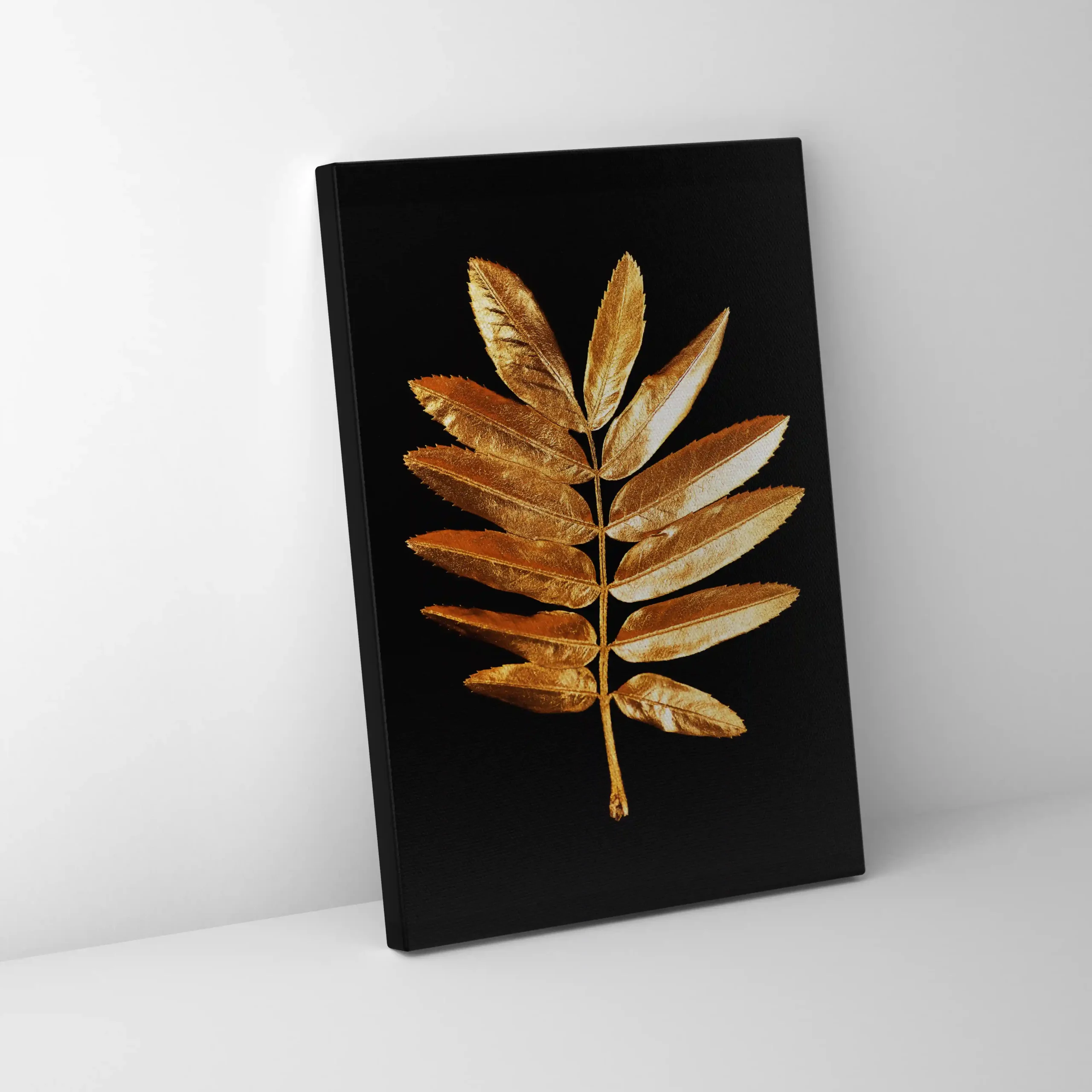 Abstract image of a gold fern leaf on a black background.