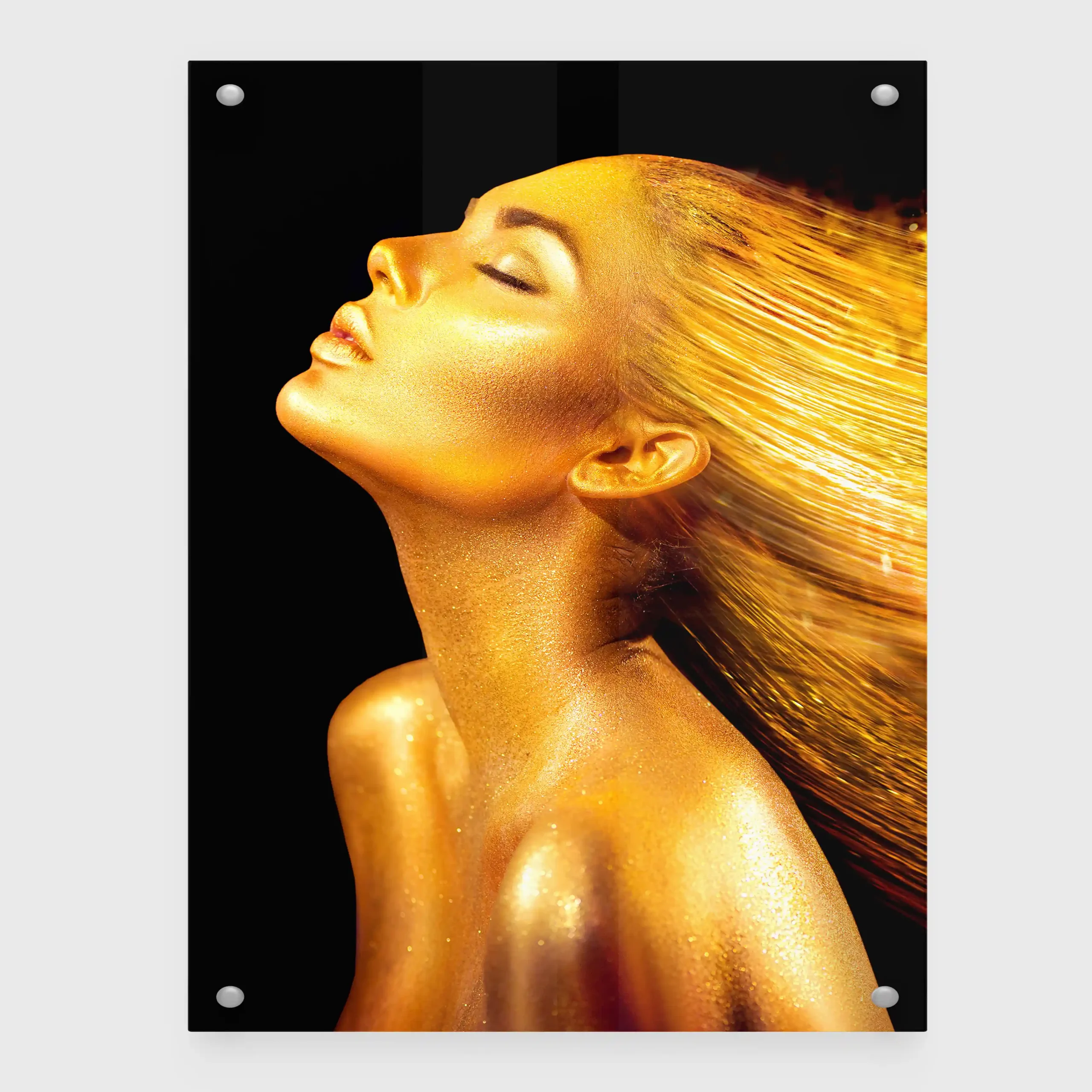 Abstract portrait of a woman with gold body paint and flowing hair.