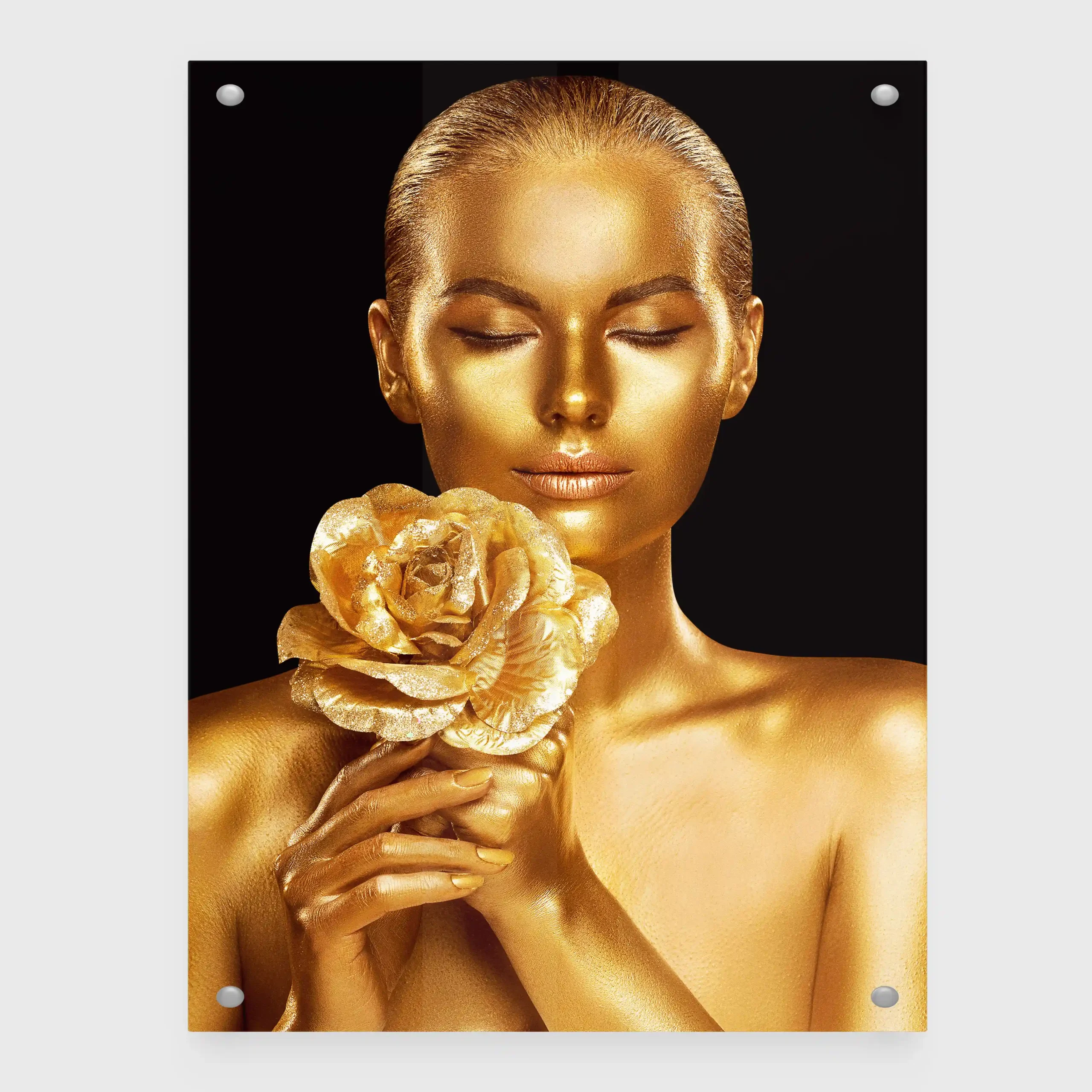 Abstract portrait of a woman with gold body paint and golden rose.